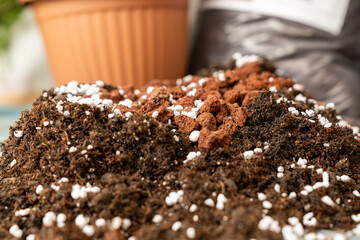 rich organic potting soil with perlite and clay pebbles, perfect for gardening, plant growth,...