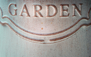 The inscription Garden on the metal surface