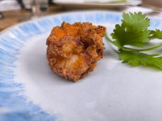 Delicious shrimp dish served with garnished fresh herbs