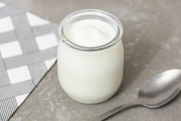 Yogurt Glass Jar on Table with spoon