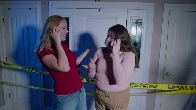 women laughing at crime scene