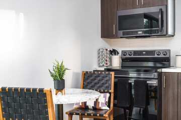 Kitchen table chairs appliances in a vacation rental home interior