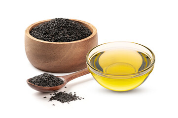 Sesame oil in a glass bowl with sesame in wooden bowl and spoon isolated on white background.