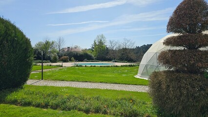 Modern Geodesic Dome with Pool in Tranquil Spring Garden