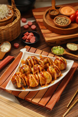 Takoyaki stuffed with sausage and mentai sauce