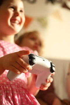 little girl playing on the console