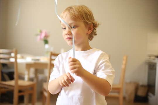 little boy playing with balloon