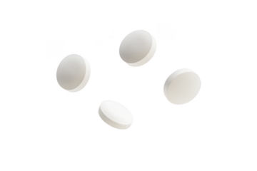 Four white round pills floating isolated on transparent background