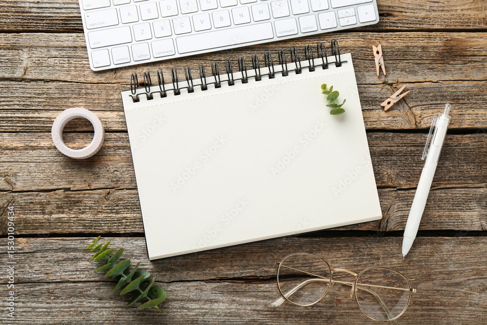 Poster flat lay composition with notebook on wooden table