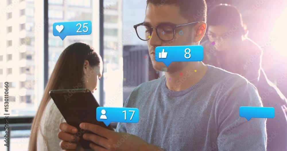 Poster coworkers tapping tablet after notification and monitoring social media stats with floating bubbles