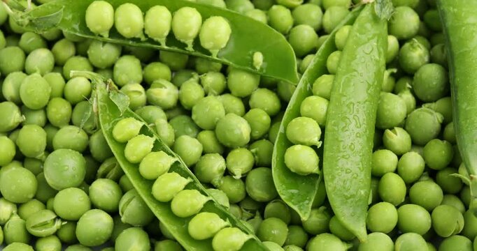 Pile of fresh green peas as background, top view