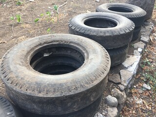 Stack of Old Used Tires Outdoors Recycling, Reuse, and Upcycling Potential