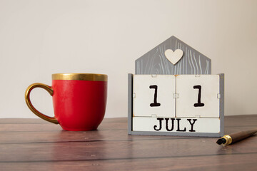 July 11. Hand writing text World Benzodiazepine Awareness Day on calendar date.