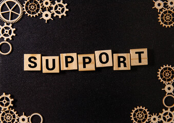 Team Holding Building Blocks Spelling out Support.