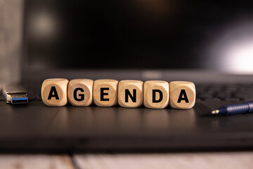 There are bright multi-colored stickers with the text AGENDA