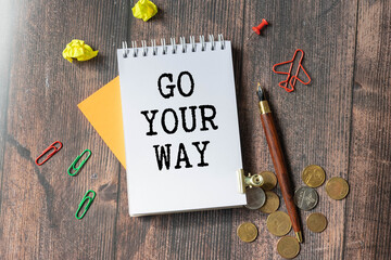GO YOUR WAY text on torn paper.