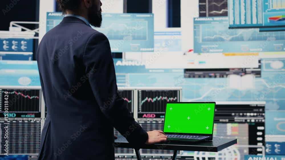 Poster general director with a chroma key display reviewing performance metrics, finance graphs and strateg