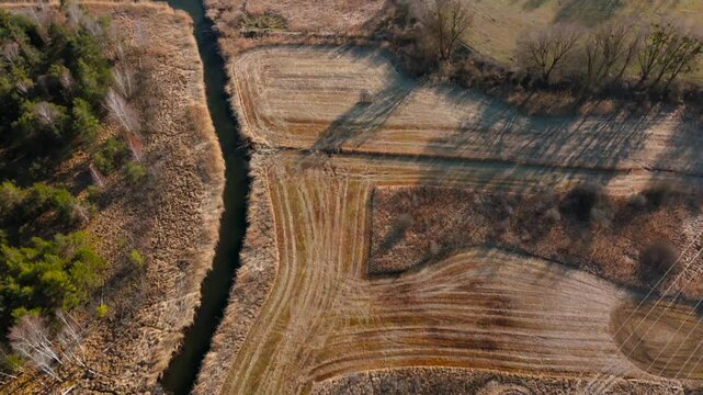 Aerial view of Upper Wurm River between Starnberg and Leutstetten, Bavaria. Clear water, wetlands, green meadows, and forests. Only outflow of Lake Starnberg, flowing through nature reserve in spring
