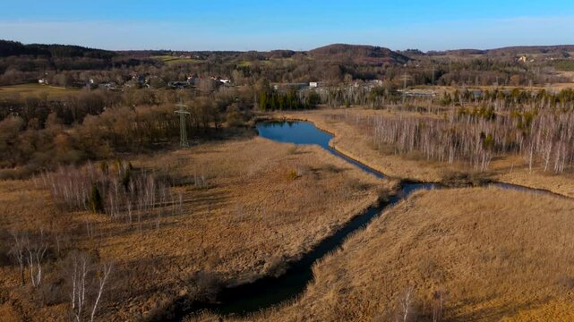 Aerial view of the upper course of the Wurm River from Starnberg to Leutstetten. The Leutstettener Moos nature reserve is located in the Leutstetten district of Starnberg, Upper Bavaria, Germany. 