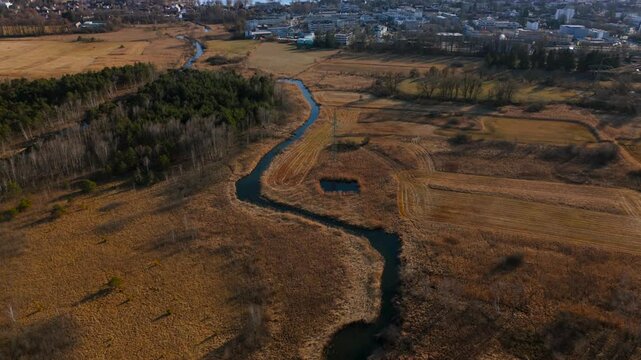 Aerial view of the upper course of the Wurm River from Starnberg to Leutstetten. The Leutstettener Moos nature reserve is located in the Leutstetten district of Starnberg, Upper Bavaria, Germany. 