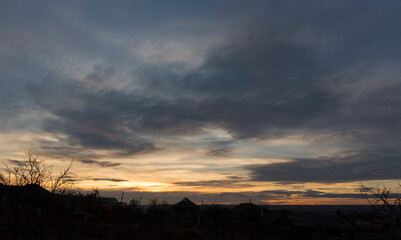 Landscape at sunset. Tragic gloomy sky. Panorama. Crimson twilight.