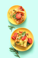 Plates of pasta with tomato sauce and cheese on turquoise background