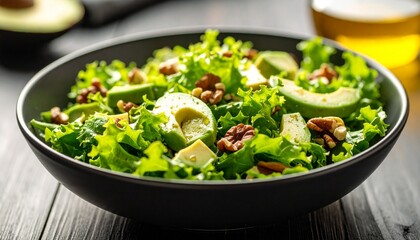 Close-up of a salad bowl with leafy greens, avocado slices, nuts, and a drizzle of olive oil, healthy breakfast eating concept