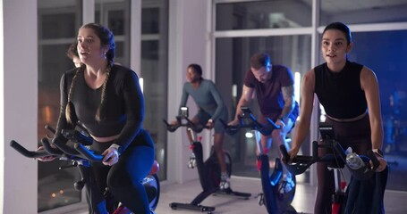 Fitness, class or people on exercise bike for cardio, body health and wellness at night. Gym, group and indoor cycling for late workout, aerobic challenge or endurance training for sports with energy - Powered by Adobe