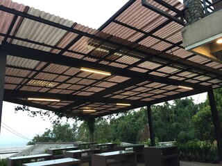 Modern Outdoor Patio Design with Polycarbonate Roofing and LED Lighting