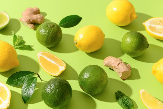 Ingredients for preparing lemonade on green background