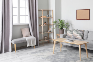 Modern interior of living room with sofa and shelving unit