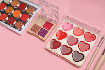 Set of makeup cosmetics on pink background