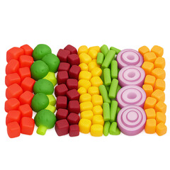 A colorful arrangement of various toy vegetables, neatly organized in rows.