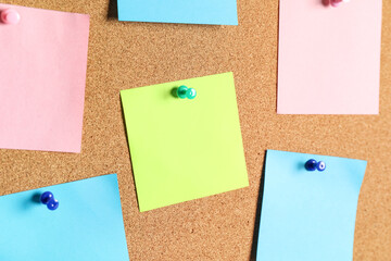 Blank sticky notes on cork board as background, closeup