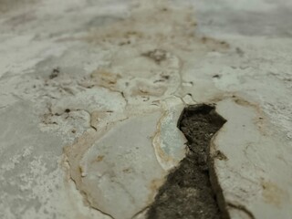 Macro texture of old wall with peeling paint. Ideal for grunge backgrounds, digital art, and vintage-inspired design work.