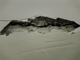 Detailed Close-Up of Cracked and Peeling White Wall Paint – High-Resolution Grunge Texture for...