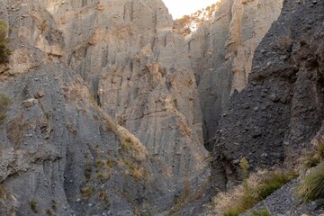 Canyon walls, formed by erosion, create a dramatic landscape in Putangirua Pinnacles, Cape...