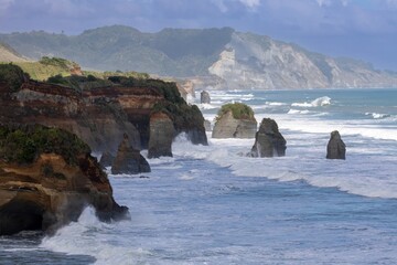Aerial view of the rugged coastline of The Three Sisters, Tongaporutu, Taranaki, New Zealand. The...