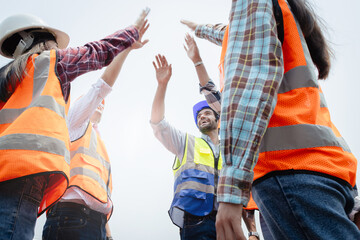 Team Construction or engineering group and worker. Teamwork and determination to succeed. Safety...