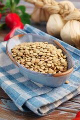Seeds placed in a blue bowl on a checkered cloth