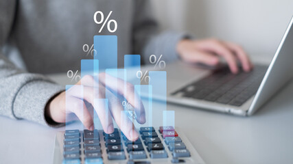 Businessman person using calculator finance chart graph investment document in office data laptop tax budget concept