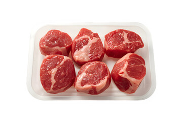 Raw beef pieces in plastic try isolated on transparent background.