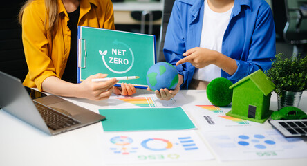 Business team meeting for ESG, net zero, and sustainability goals. Green energy, climate action, and eco-friendly strategies