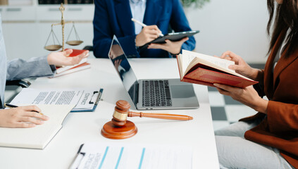 business people and lawyers discussing contract papers sitting at the table. Concepts of law,...