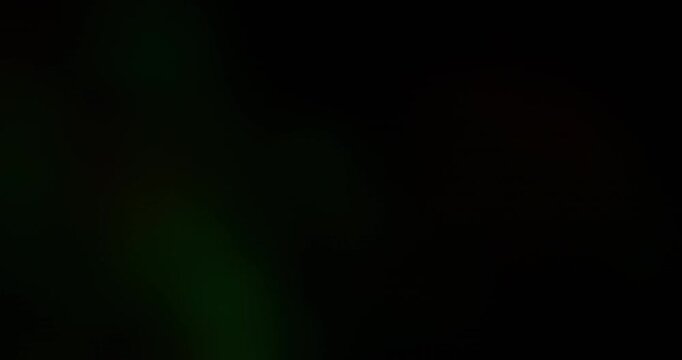 Optical blur transition. Light leak. Colorful beam glowing on dark background. Night ray overlay abstract analog refraction effect.