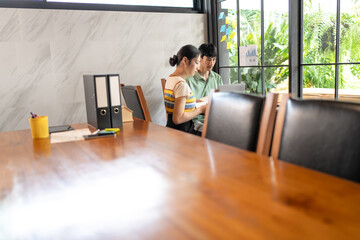 Asian Office Workers Collaborating in a Business Meeting.