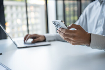 Successful Businessman Using Smartphone During Office Work