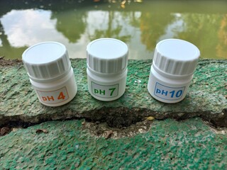 Buffer solutions in bottles. these calibration solutions are commonly found in science laboratories...