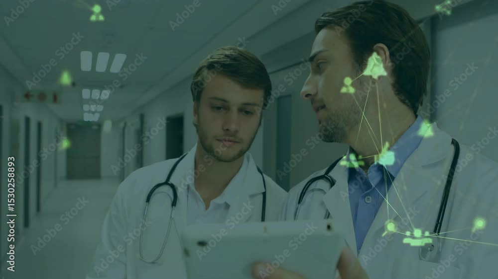 Poster doctors walking down corridor tapping tablet causing clear network overlay for patient data review