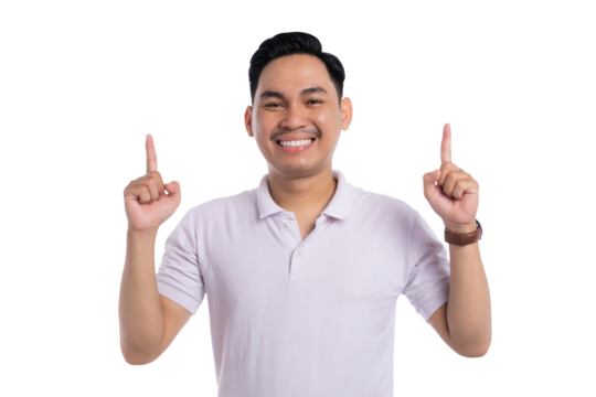 Smiling young Asian man in white polo shirt pointing upward with both index fingers isolated on transparent background